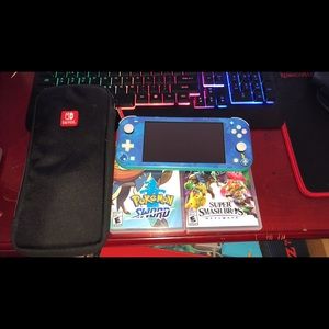 Nintendo switch lite 2 games and a case